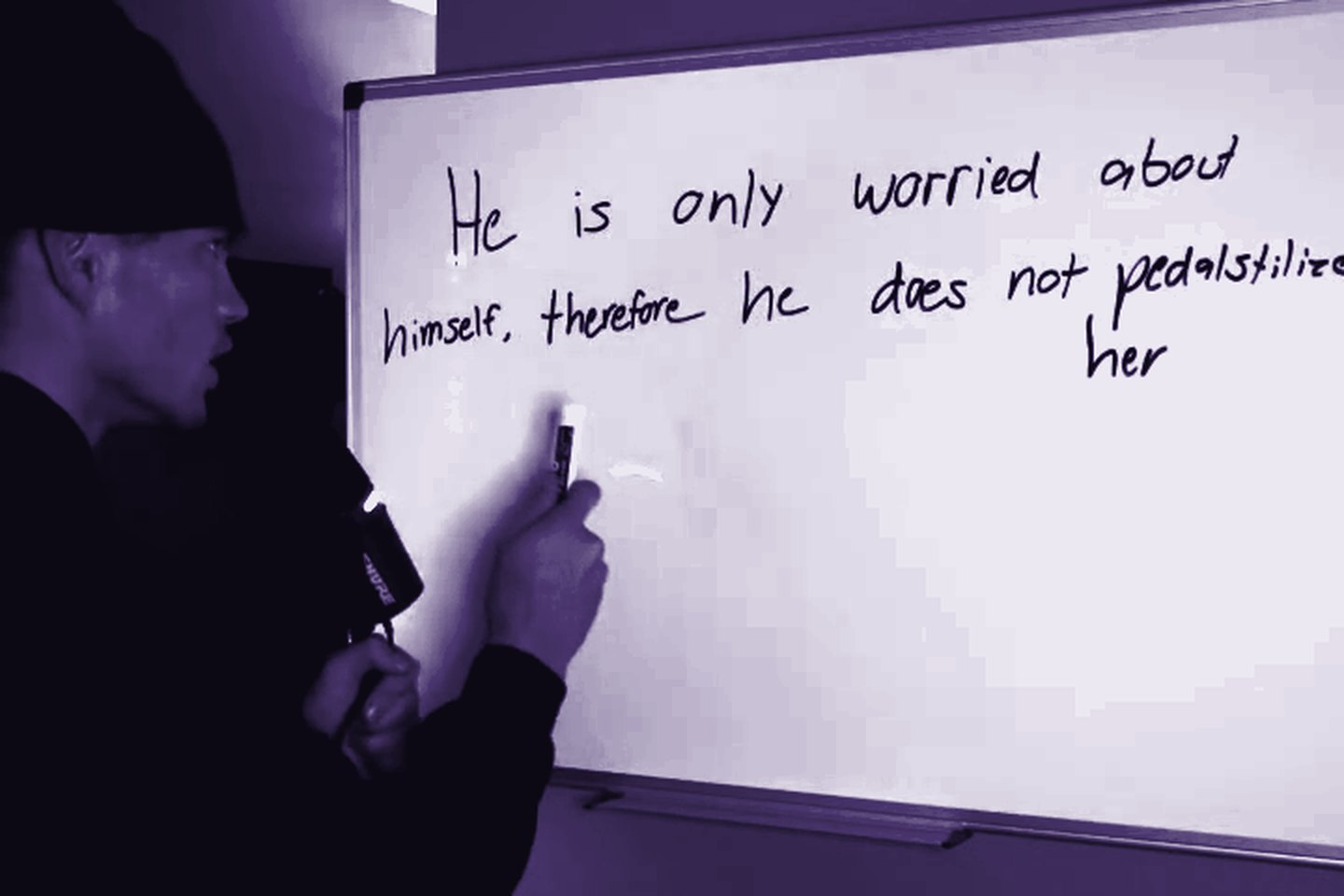Hunter Wheaton mid-breakdown at the whiteboard